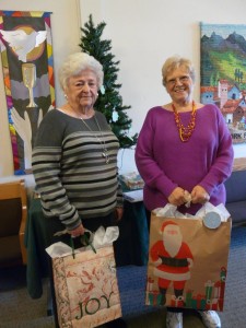 Audrey Crabtree and Sharon Hayden with collected gifts